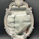 Wall mirror – sculpted silver frame, with a golden reflection and a touch of green –