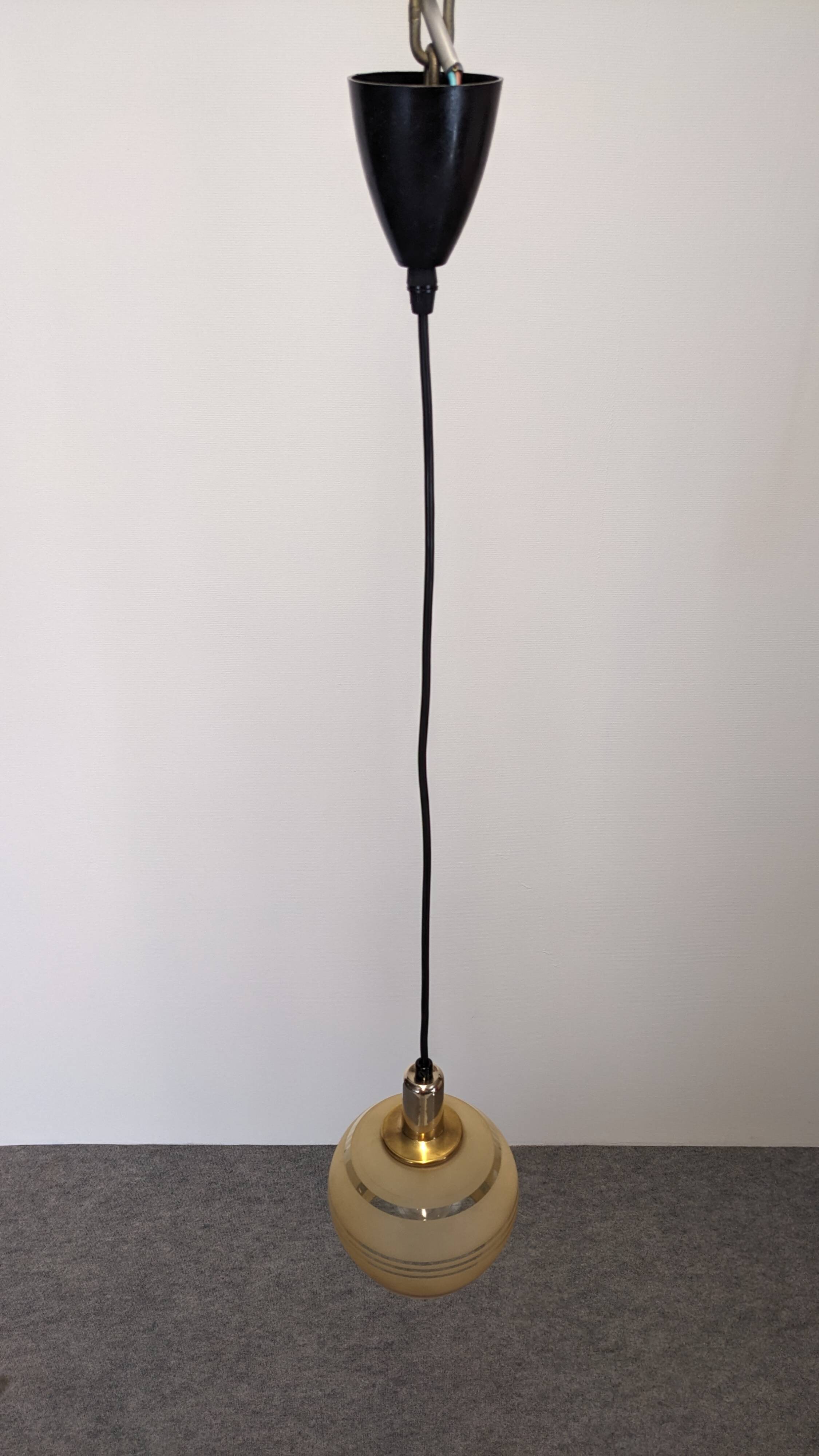 Art Deco style ball pendant light in gold glass