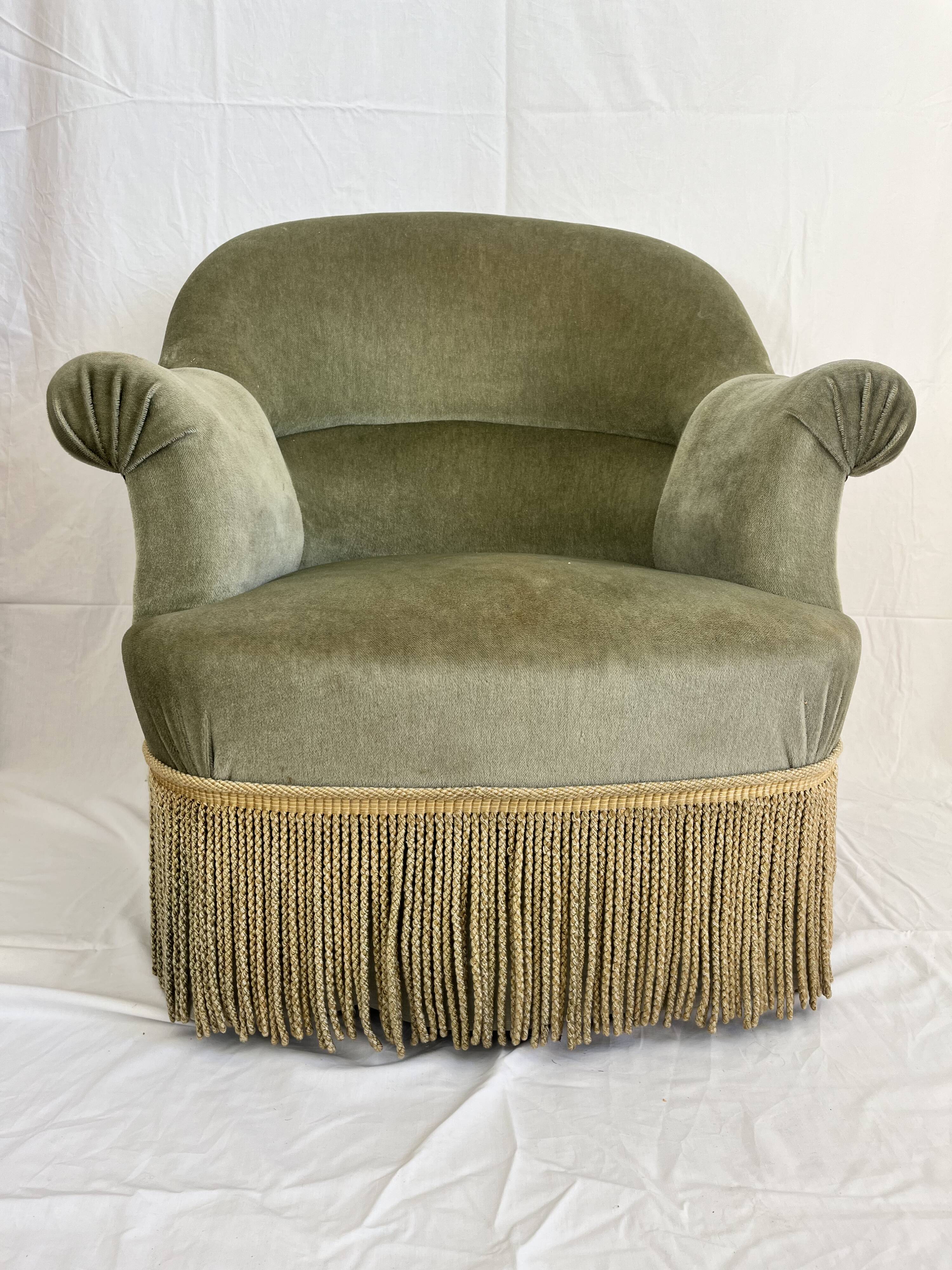 sage green toad armchairs with gold fringe