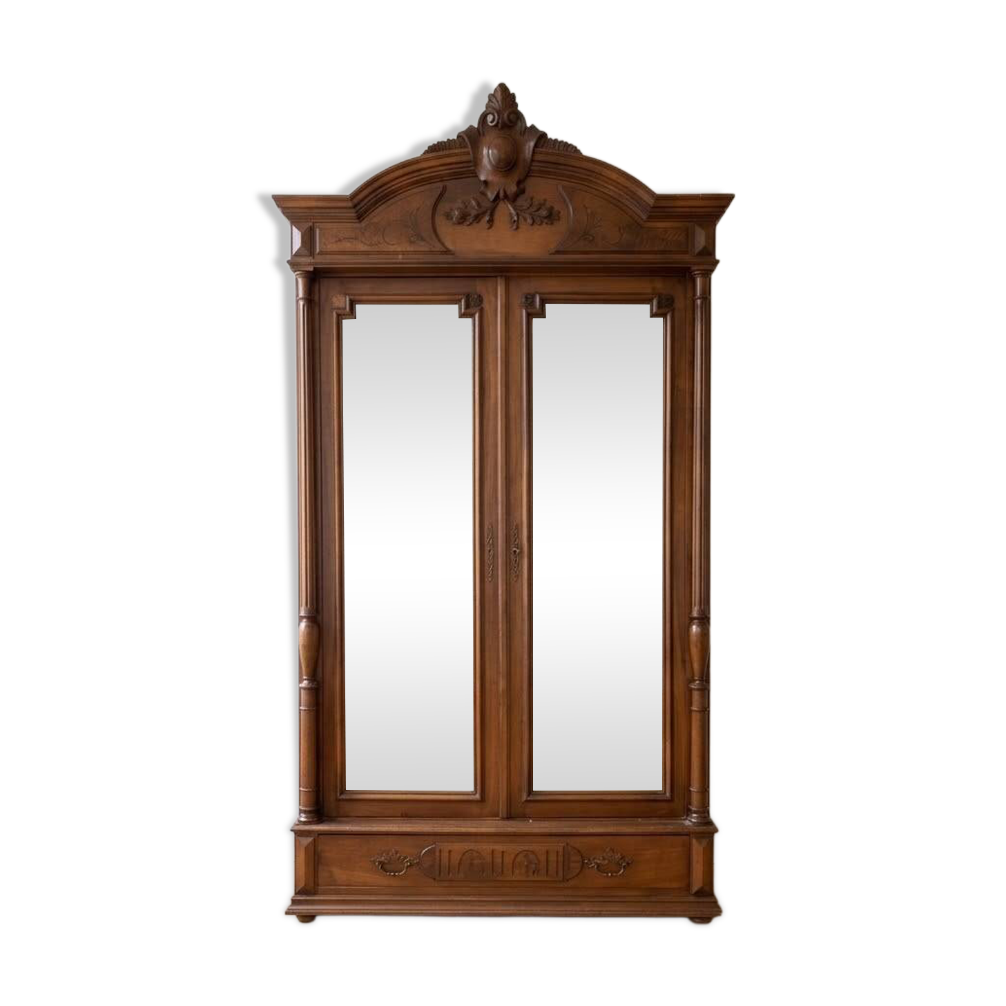 Antique walnut wardrobe with bevelled mirrors.