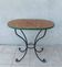 Bistro table in wrought iron and walnut