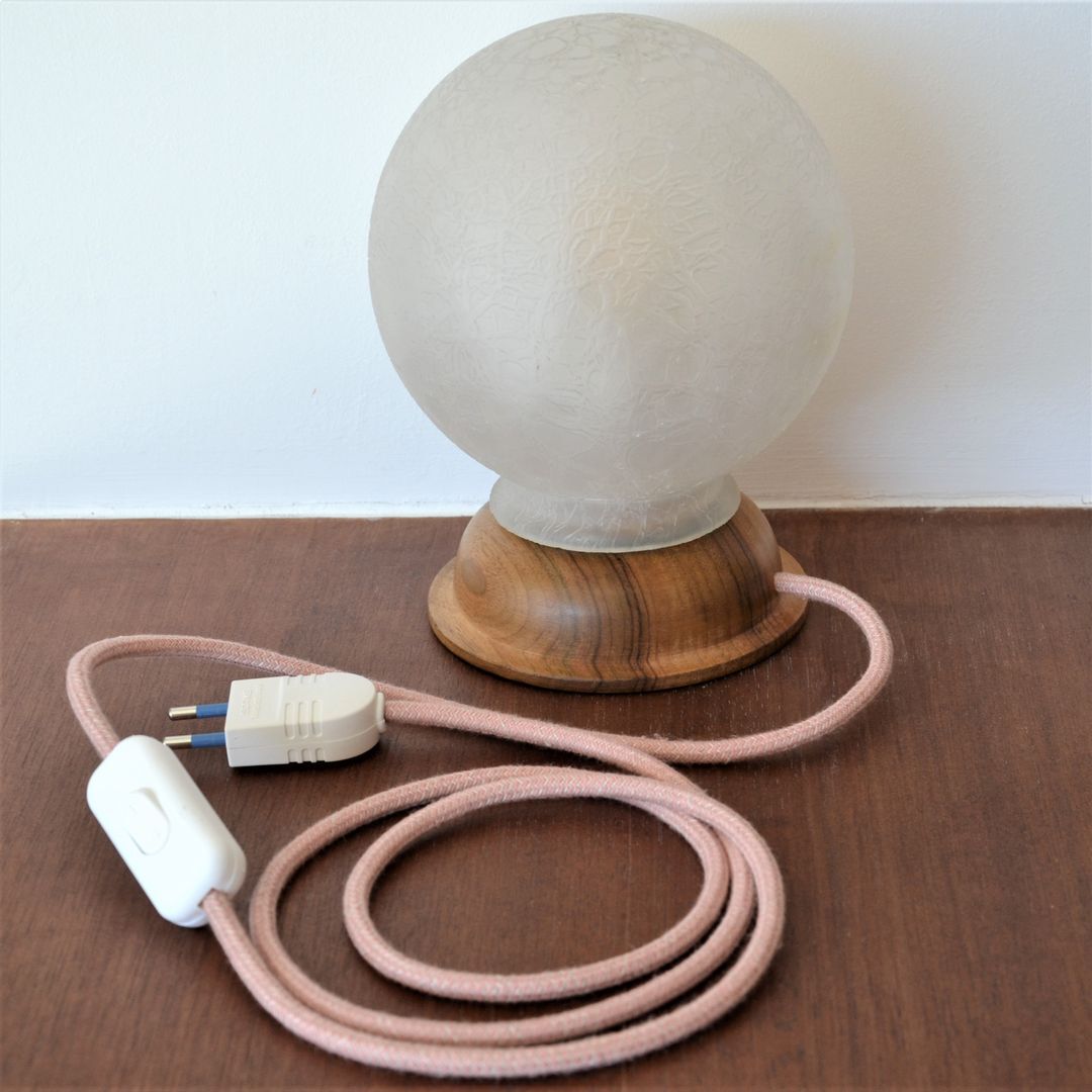 White glass globe table lamp with geometric reliefs