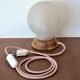 White glass globe table lamp with geometric reliefs