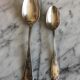Duo of silver metal spoons