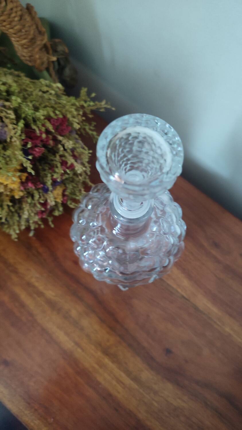 Pressed glass carafe in the shape of a bunch of grapes.