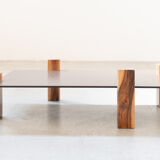 Handcrafted coffee table with ceramic glass top and walnut legs