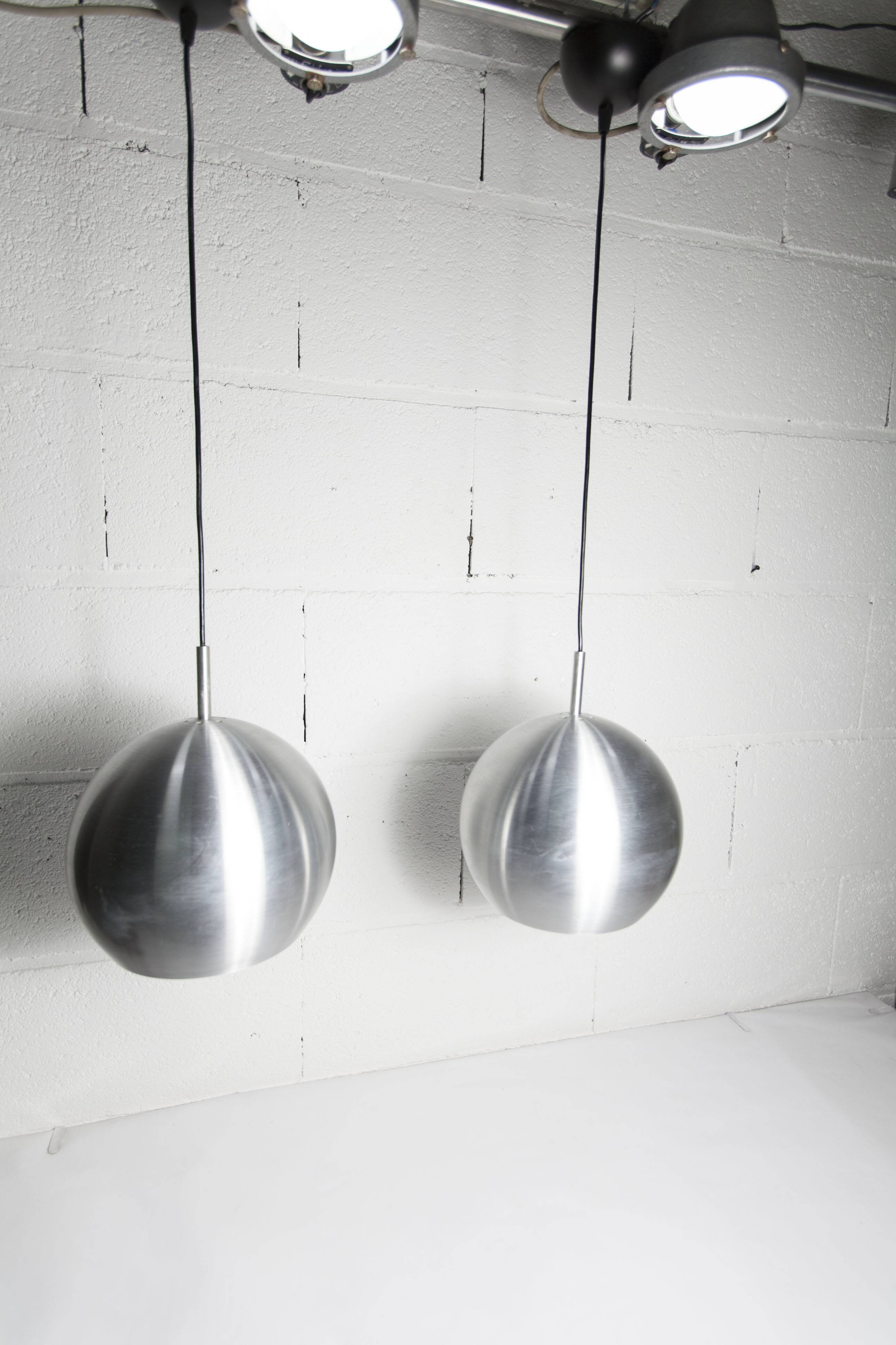 Pair of functional 70's aluminum ball pendants