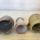 Seven beige and gray ceramic vases