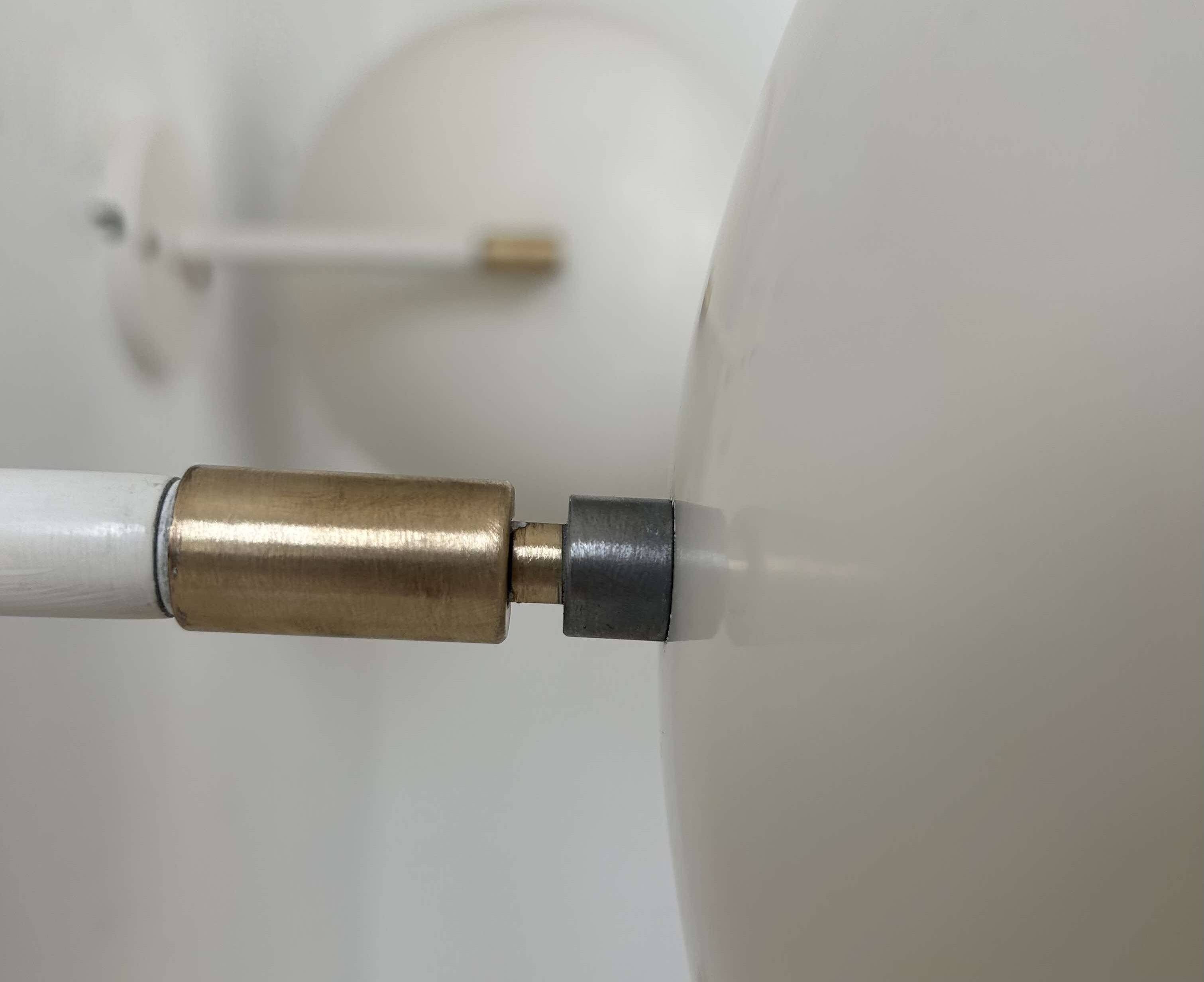 Pair of vintage adjustable wall lights, brass and white metal, France 1970