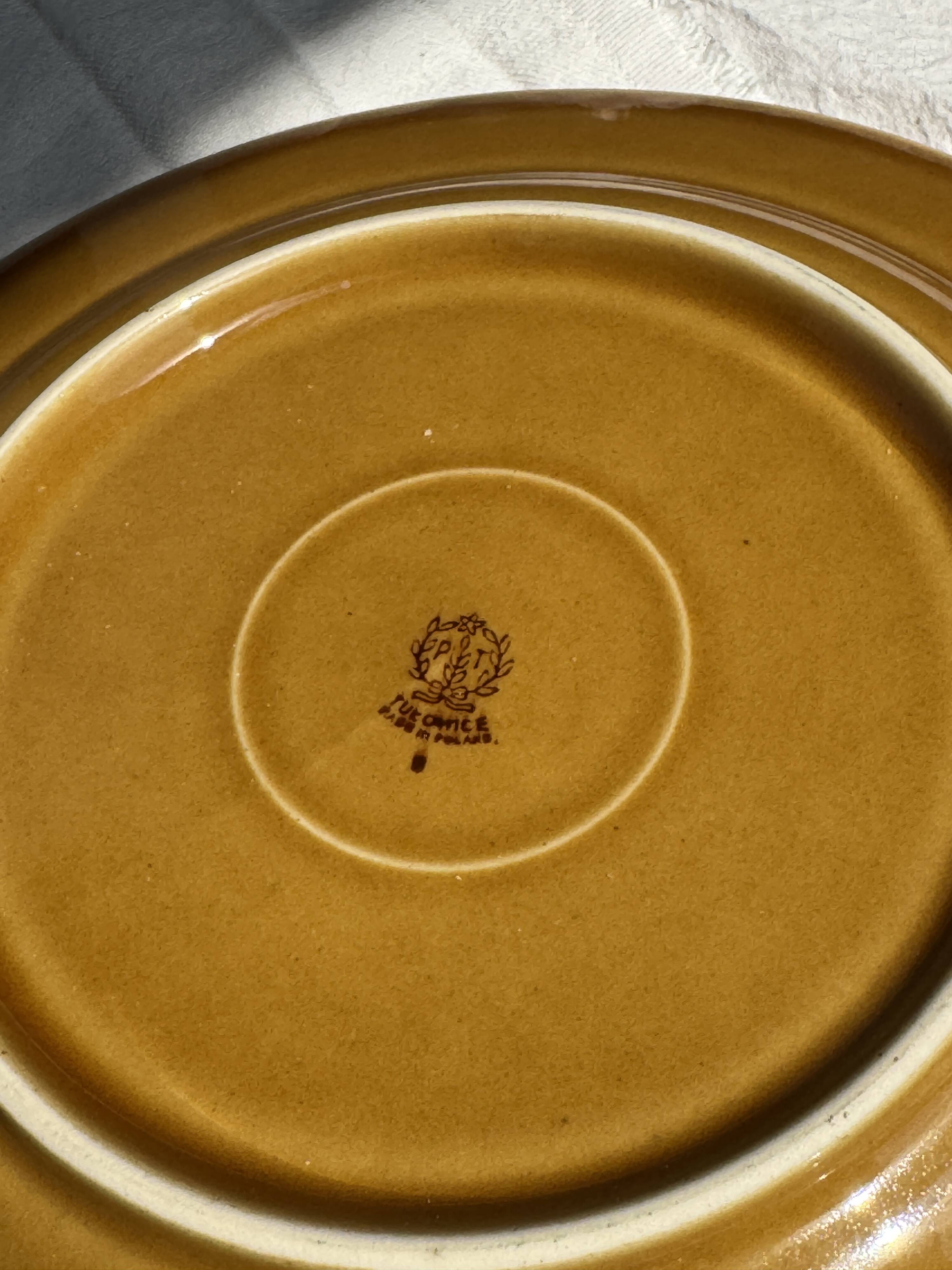 Set of 11 dark brown yellow stoneware plates D24