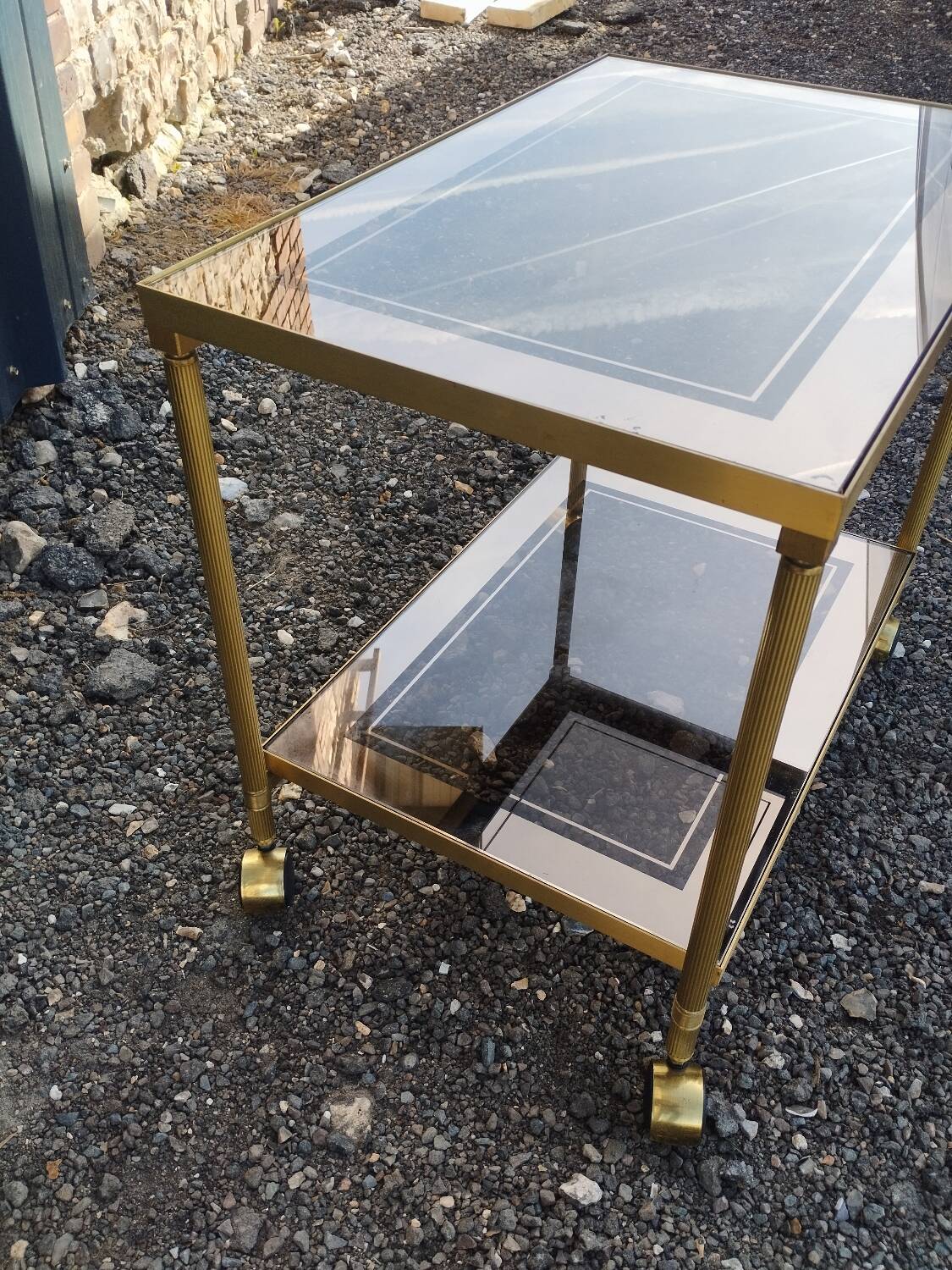 Vintage golden metal rolling dessert trolley