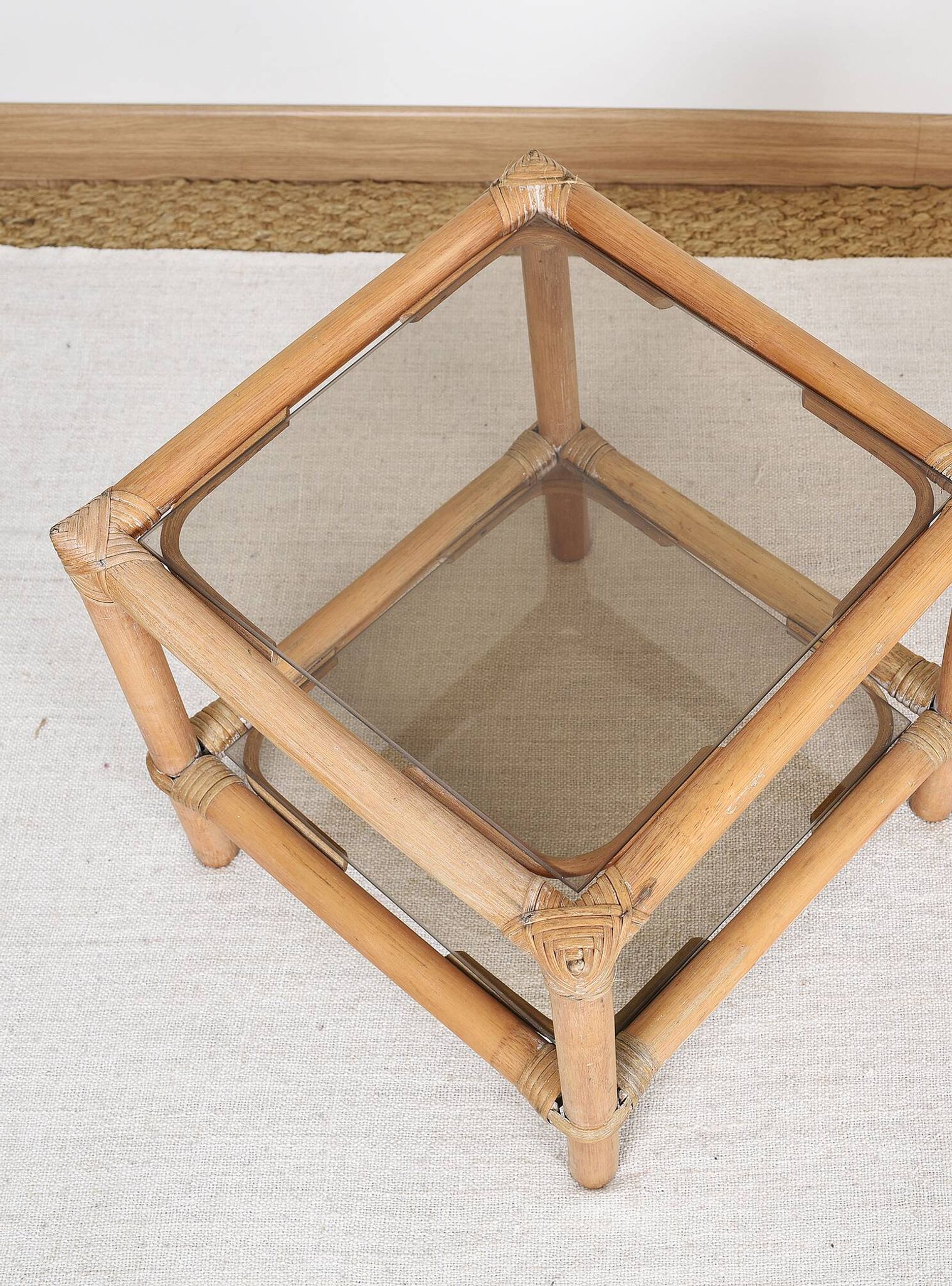 Pair of bedside tables or side tables, in rattan and smoked glass