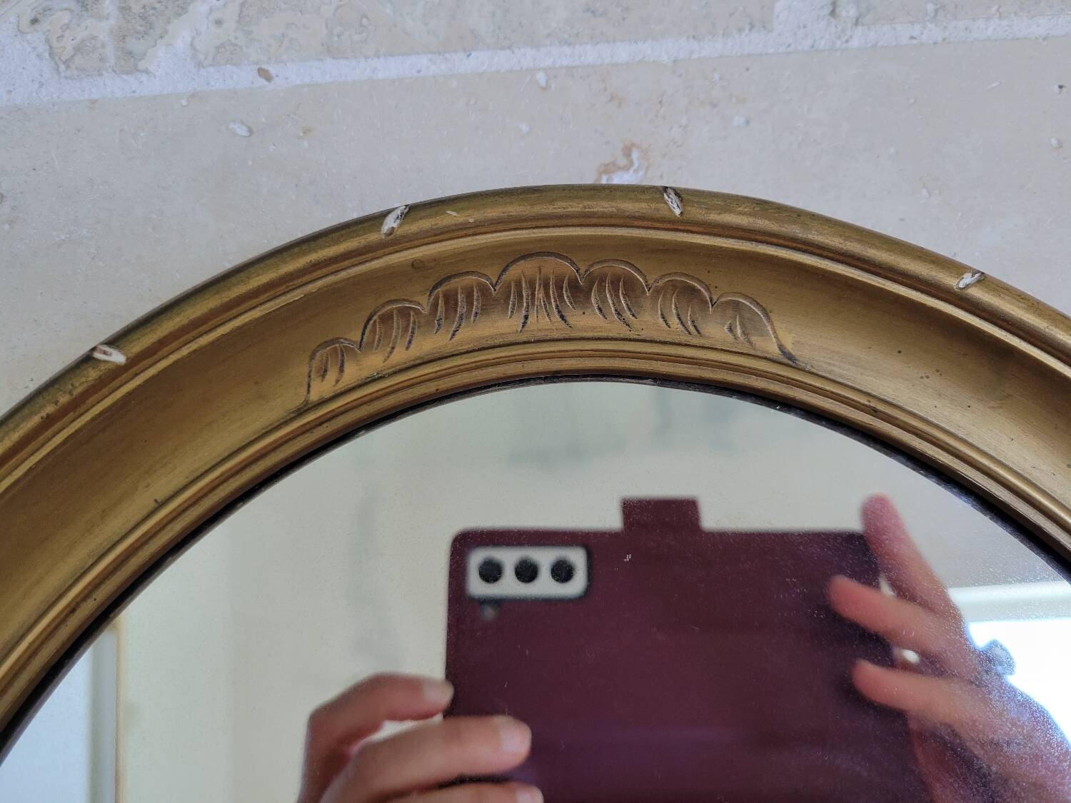 Oval mirror in gilded stucco 45 cm