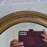 Oval mirror in gilded stucco 45 cm