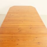 Large extendable Danish dining table in solid pine, 1970s.