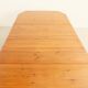 Large extendable Danish dining table in solid pine, 1970s.