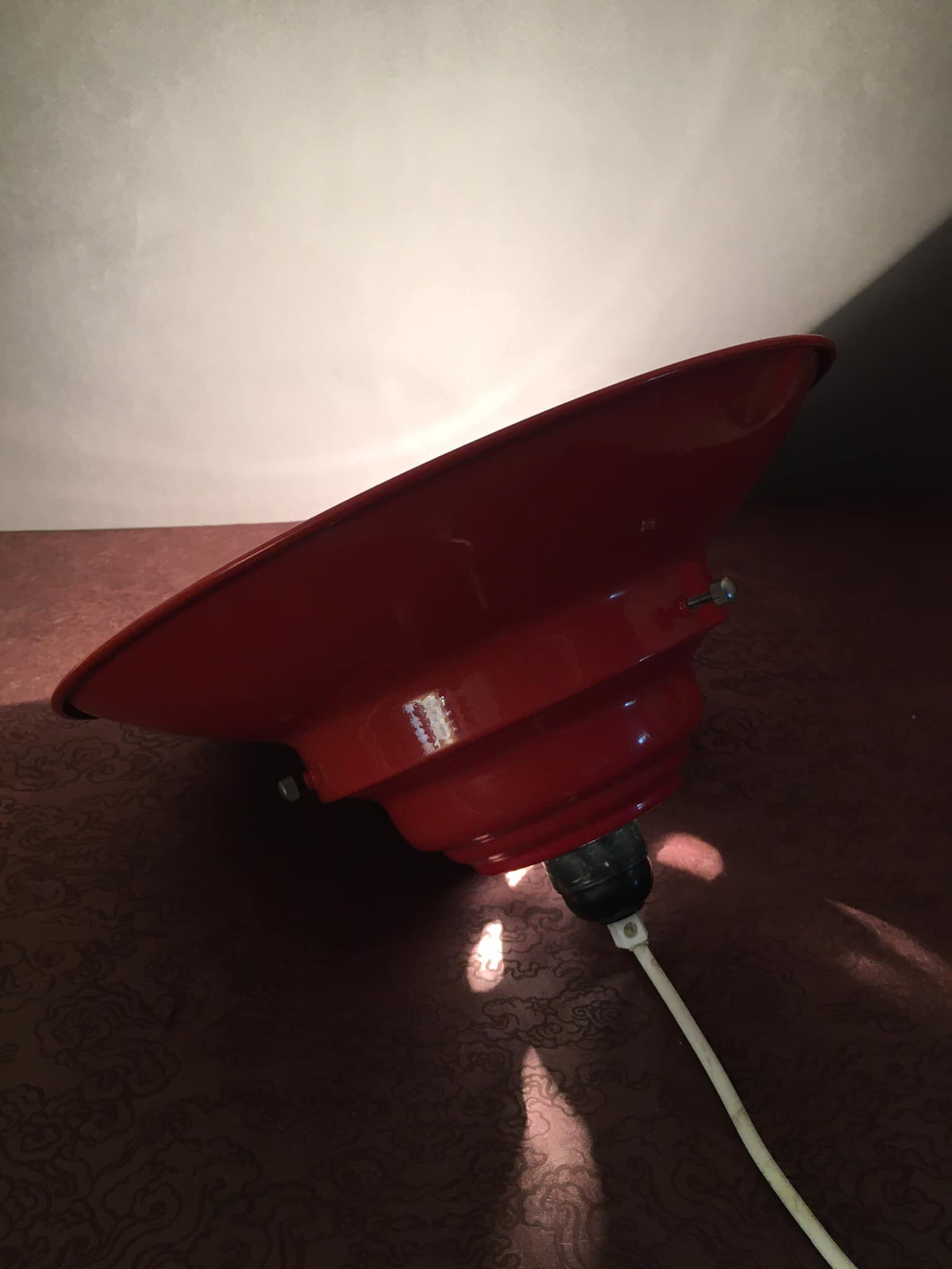 Industrial suspension in red metal