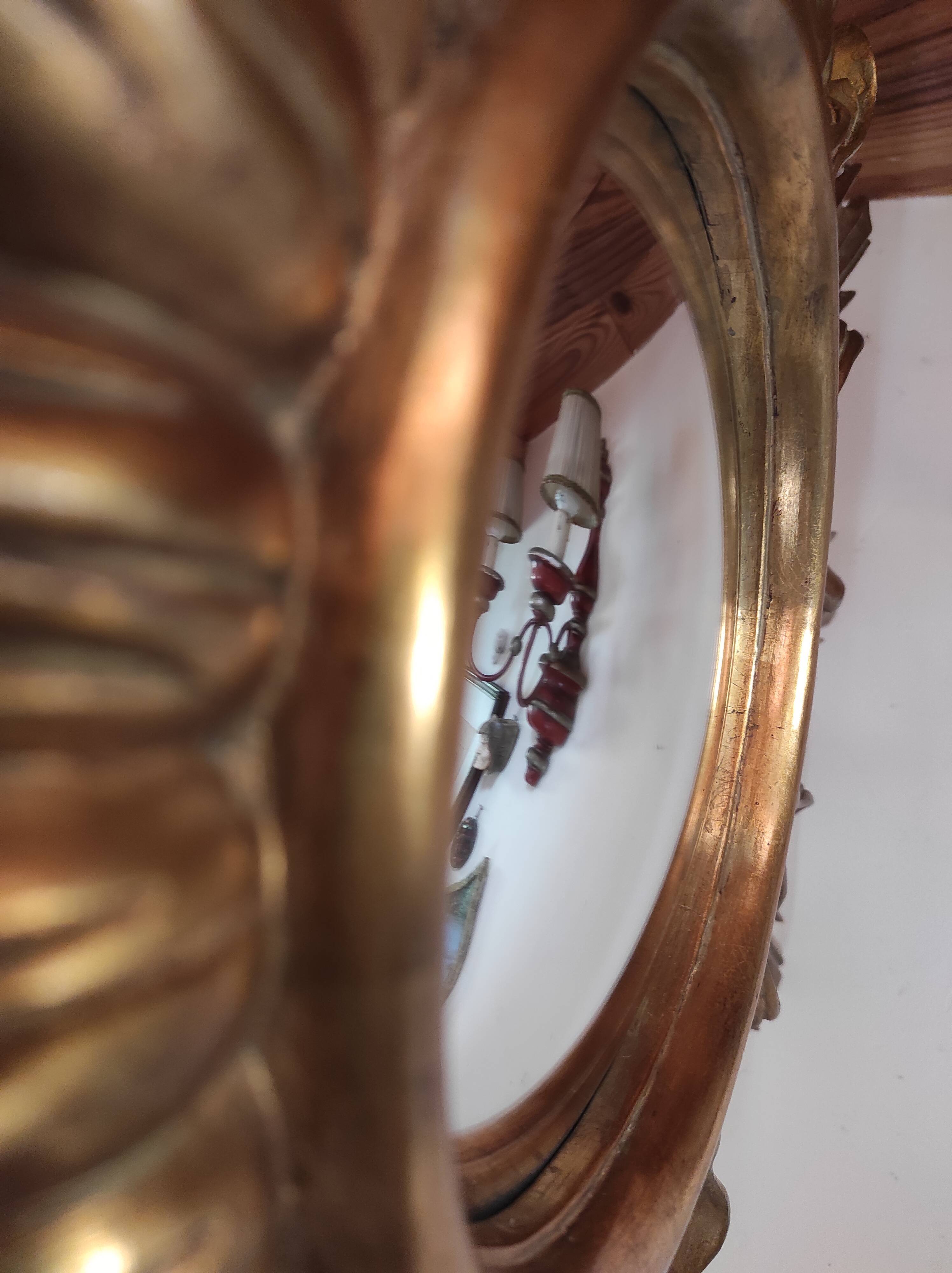 Sun mirror and witch's eye in gilded wood