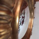 Sun mirror and witch's eye in gilded wood