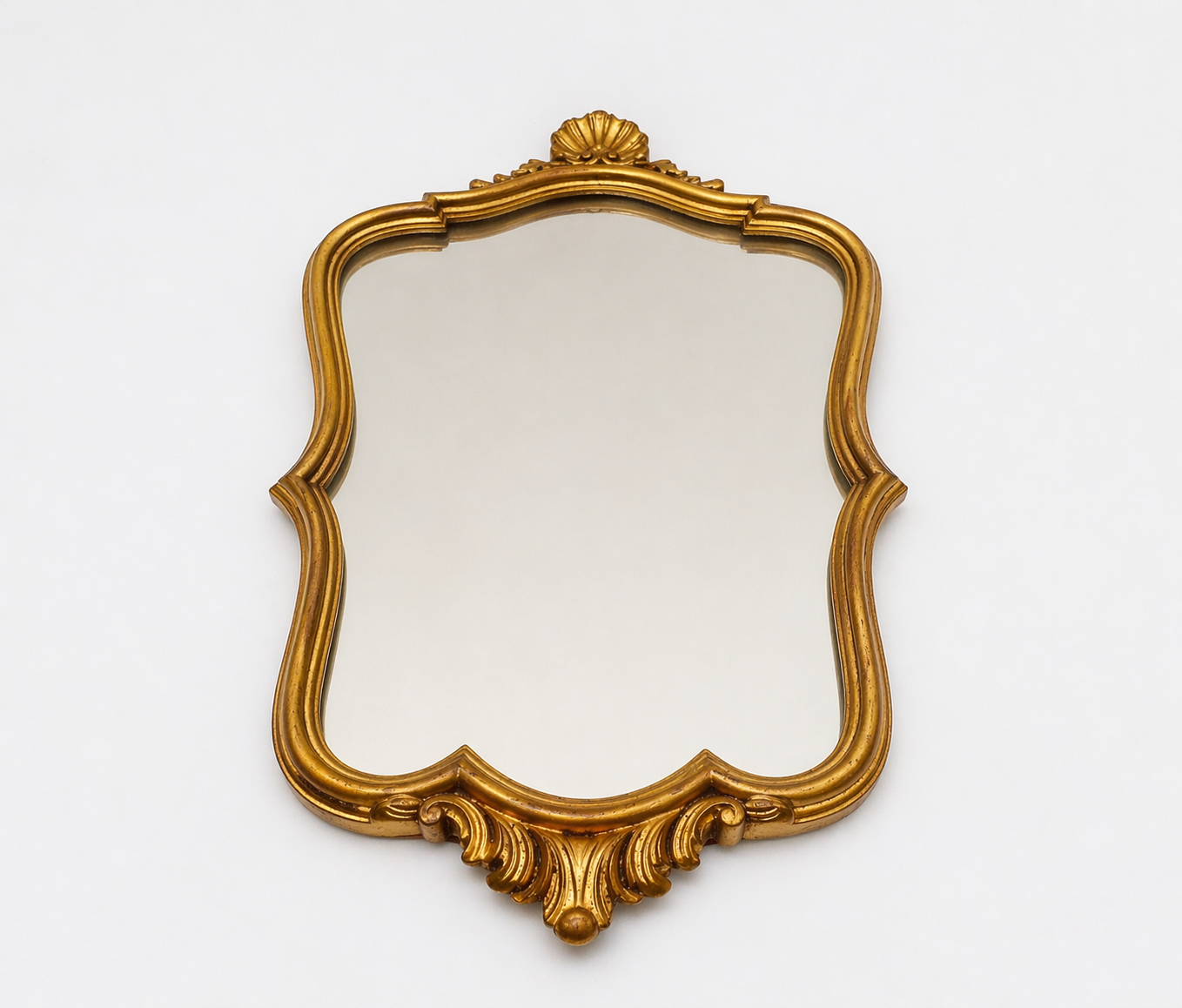 Golden wooden wall mirror in Louis XV style, shell-shaped rocaille decoration, circa