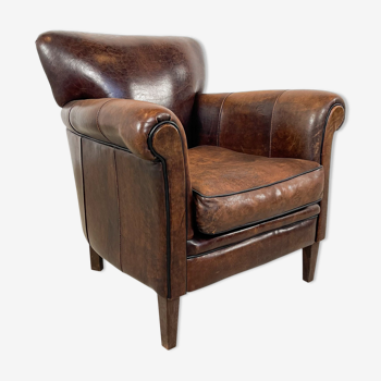 Vintage dark sheep leather club chair Fijnaart