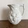 Jug in slipware with fruits