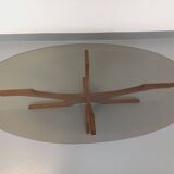 Vintage Hugues Poignant oval coffee table in teak and smoked glass from the 1970s