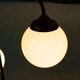 Minimalist floor lamp in glass, space age style.