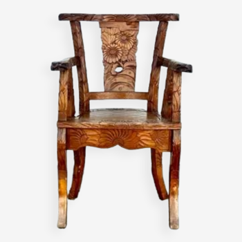 Hand stabbed teak armchair