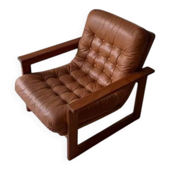Vintage lounge chair in teak and leather from the 1960s.