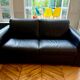 Natuzzi black leather sofa – 2-seater contemporary design