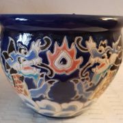 Decorative pot in multicoloured relief glazed ceramic.