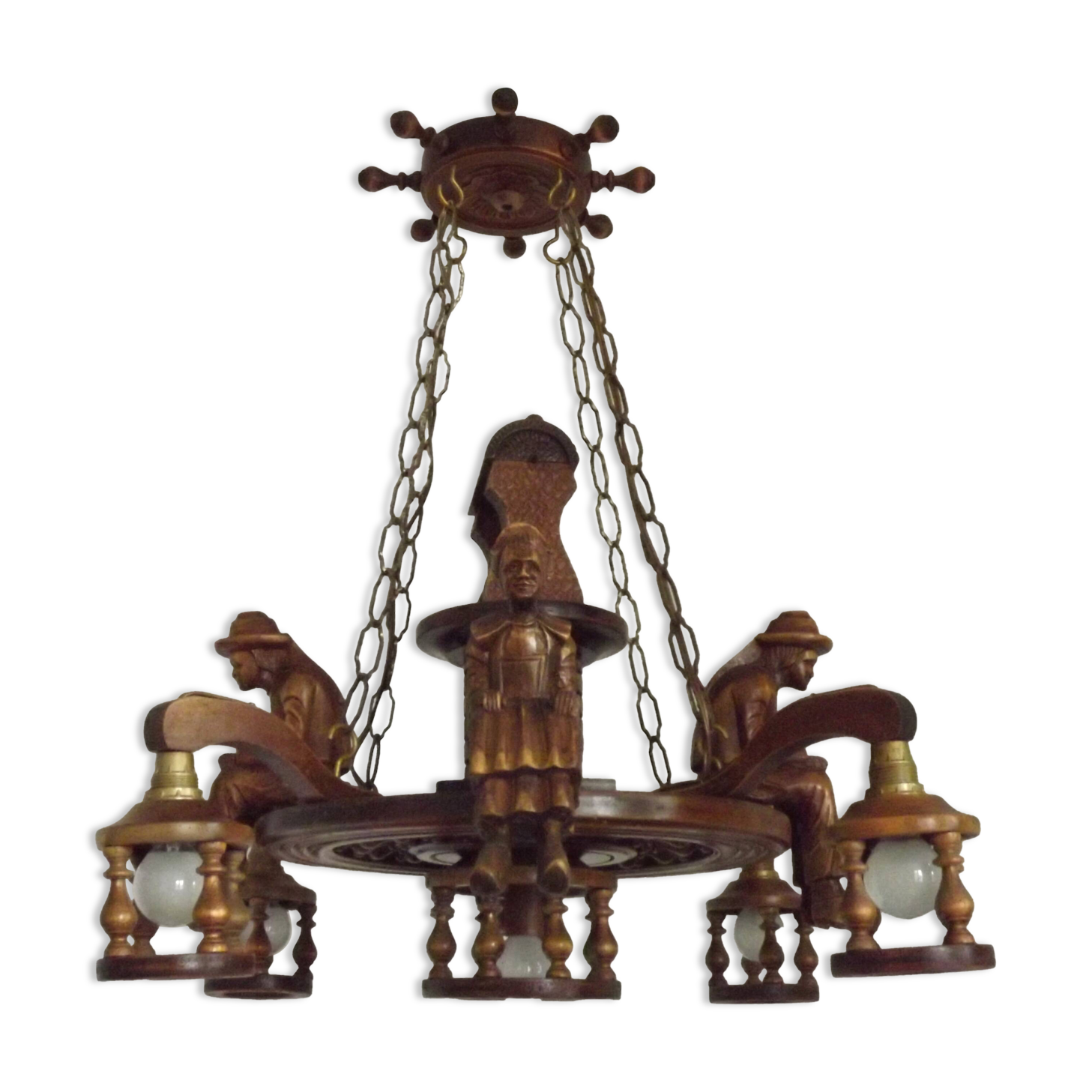 French vintage Breton chandelier with hand-carved figures, well, and lantern lights.