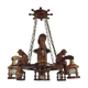 French vintage Breton chandelier with hand-carved figures, well, and lantern lights.