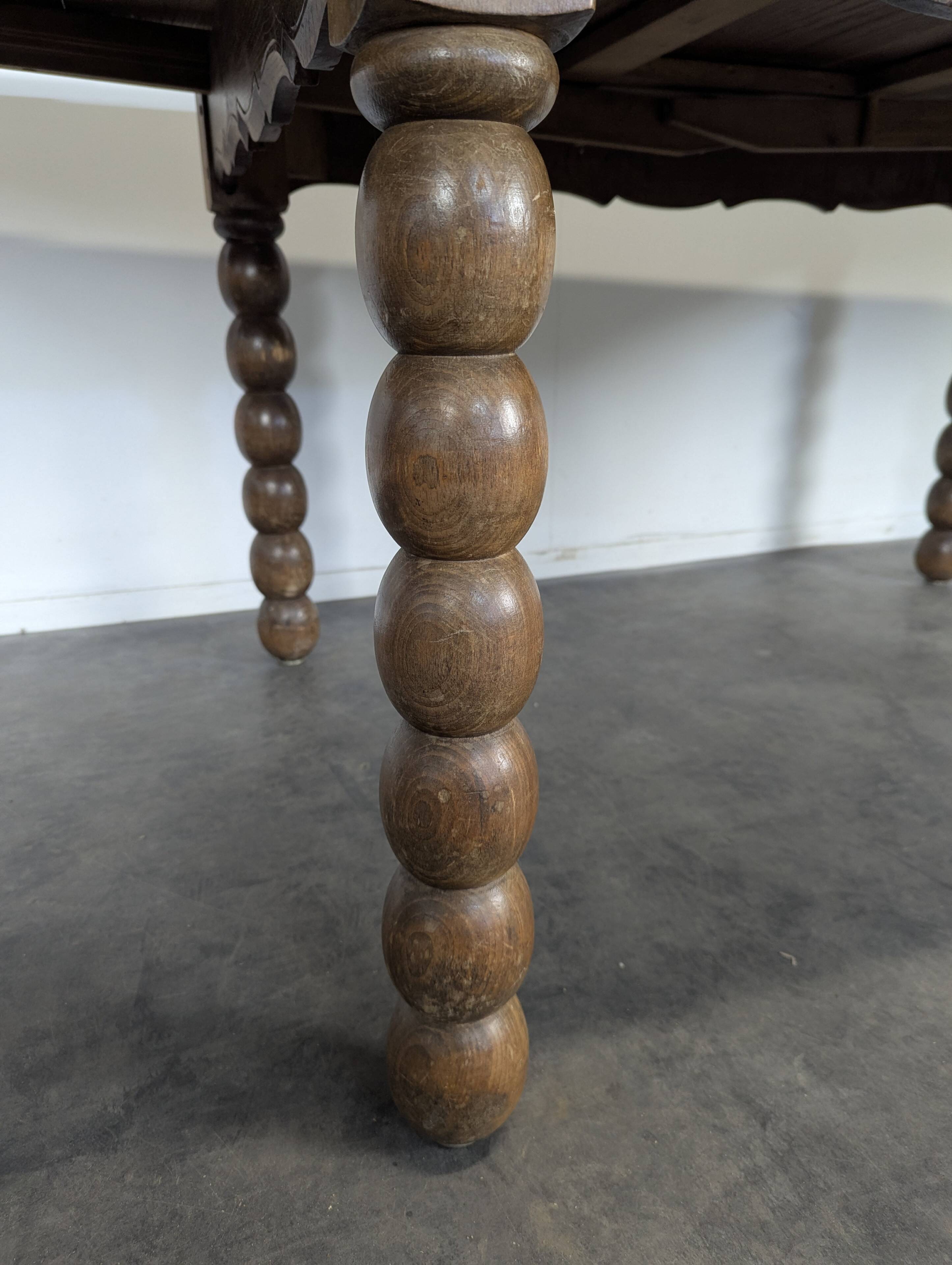 Dining table with turned oak legs.