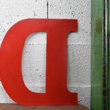 industrial letter "D" in red metal