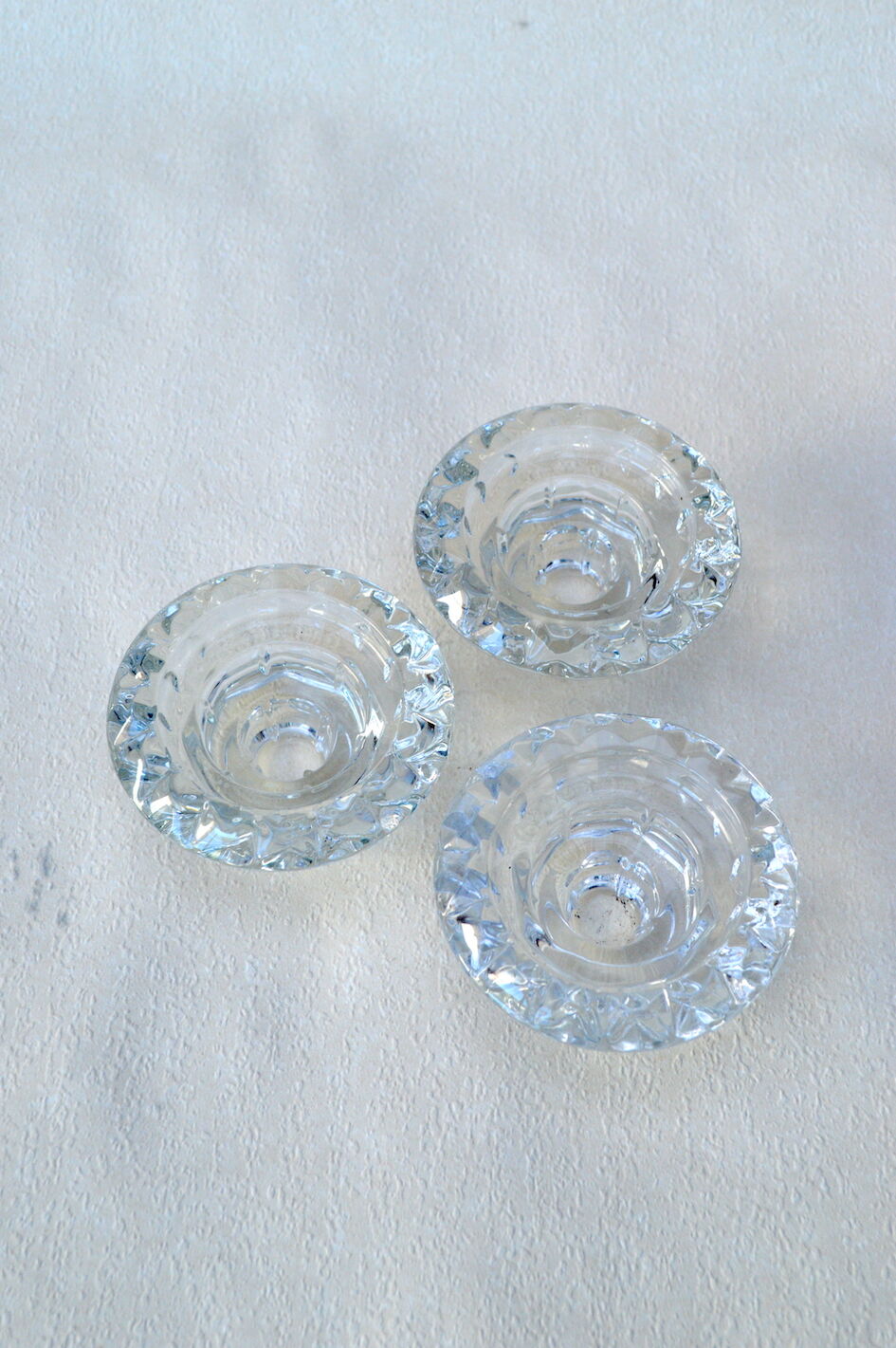 Trio of carved glass candle holders