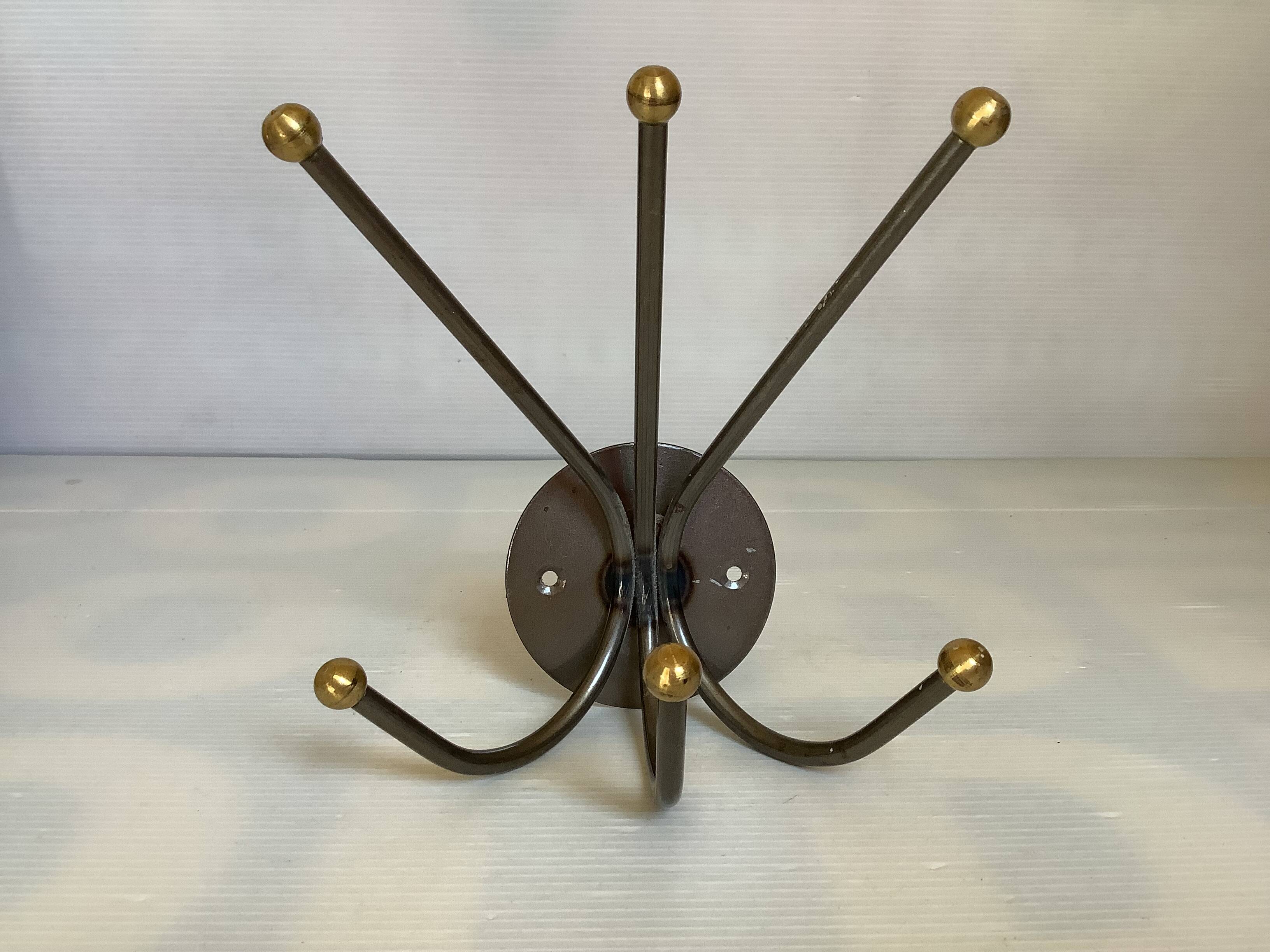 Small metal coat rack with six hooks