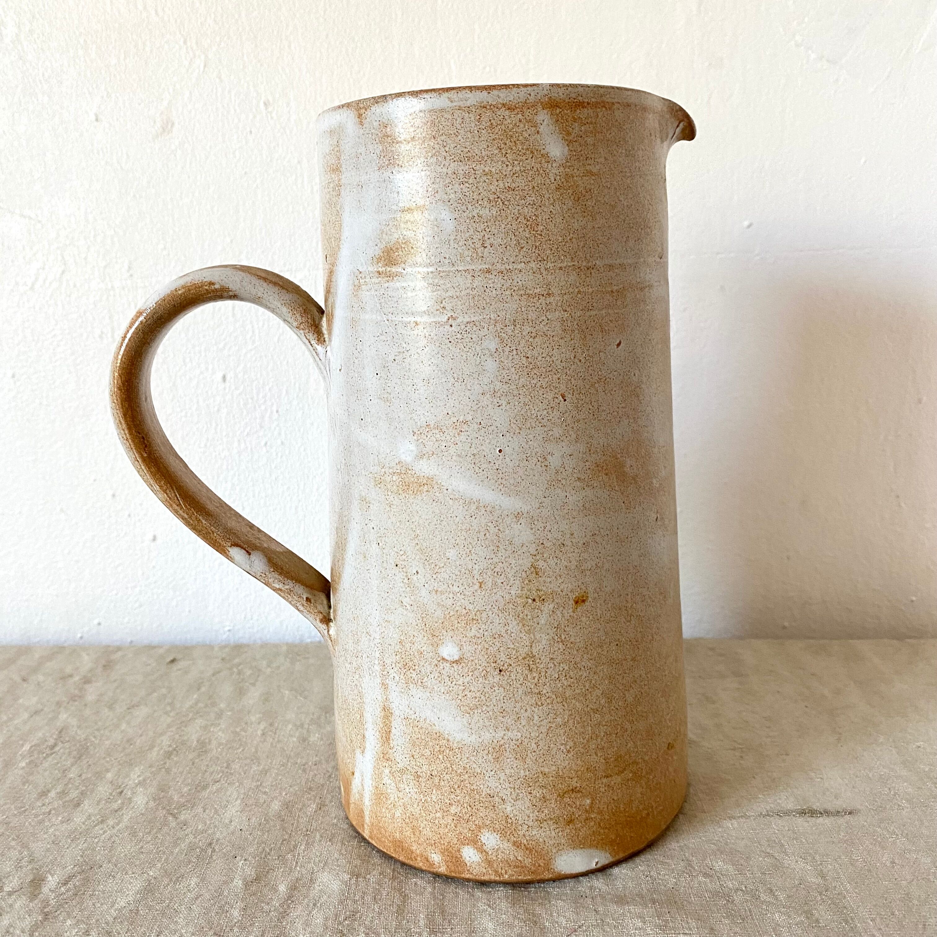 Stoneware pitcher with floral decoration