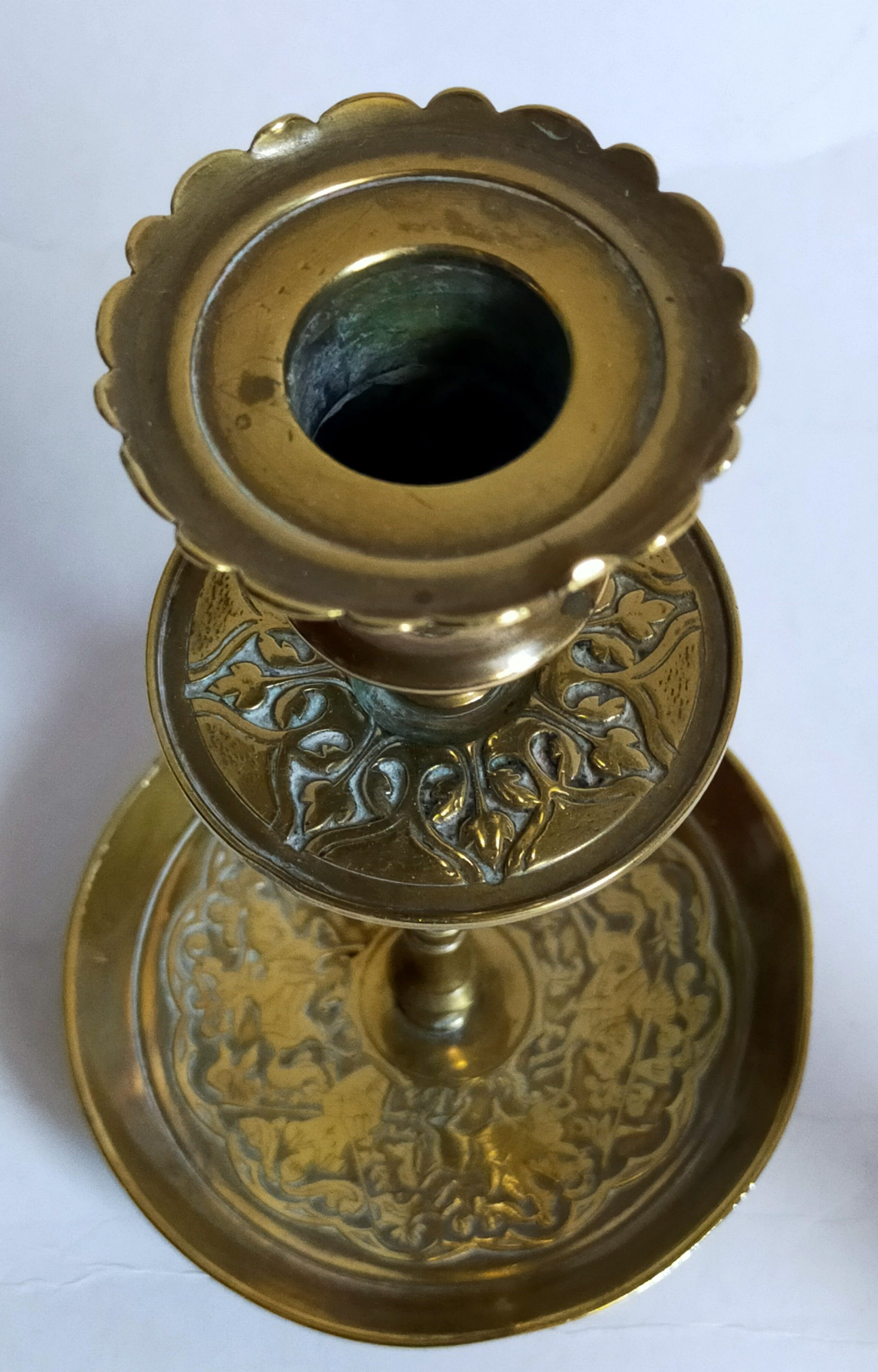 Duo of solid brass and gold metal candle holders worked old
