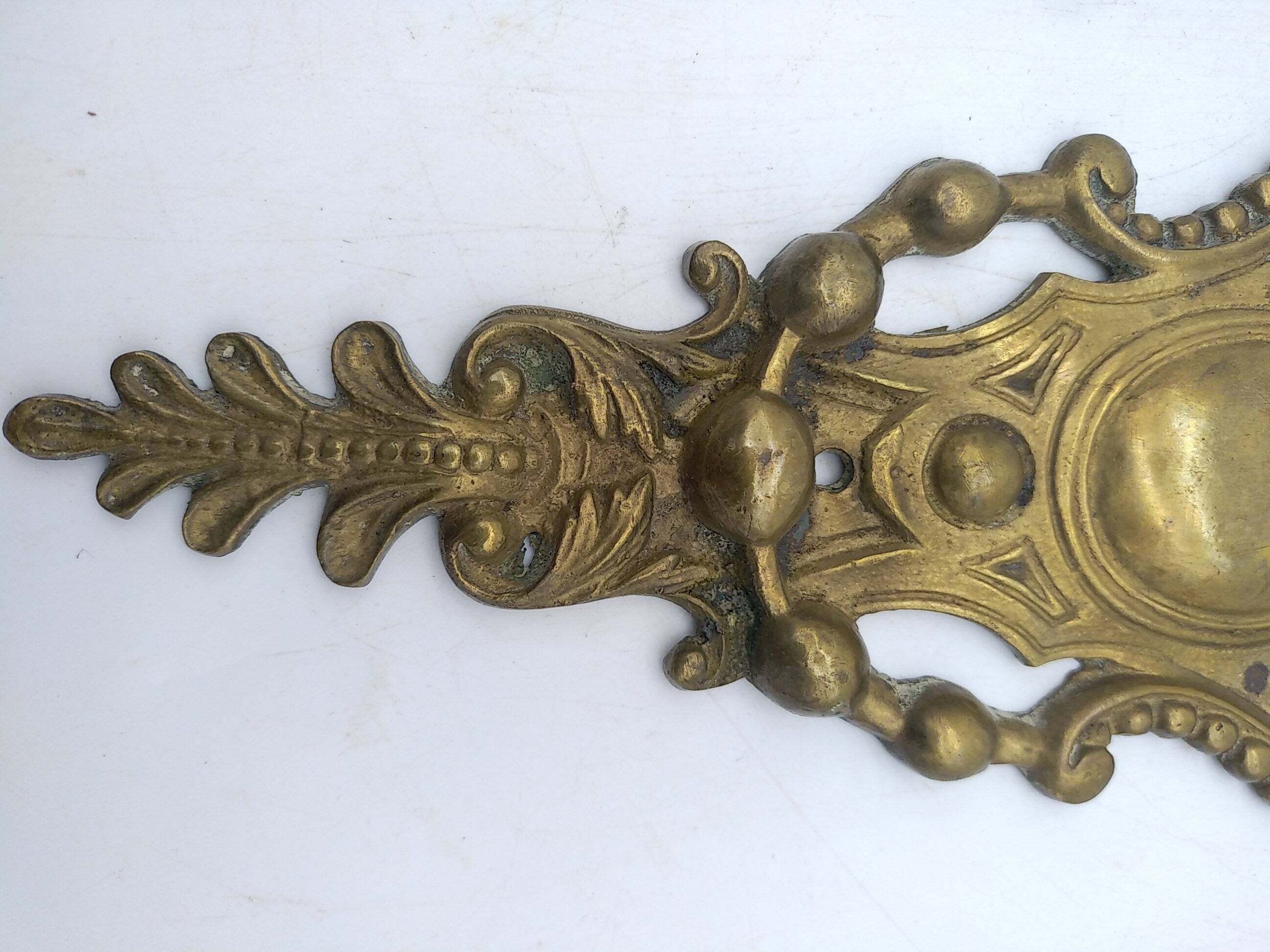 Brass lion head. Furniture decoration, leftover knocker or large nail cover?