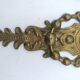 Brass lion head. Furniture decoration, leftover knocker or large nail cover?