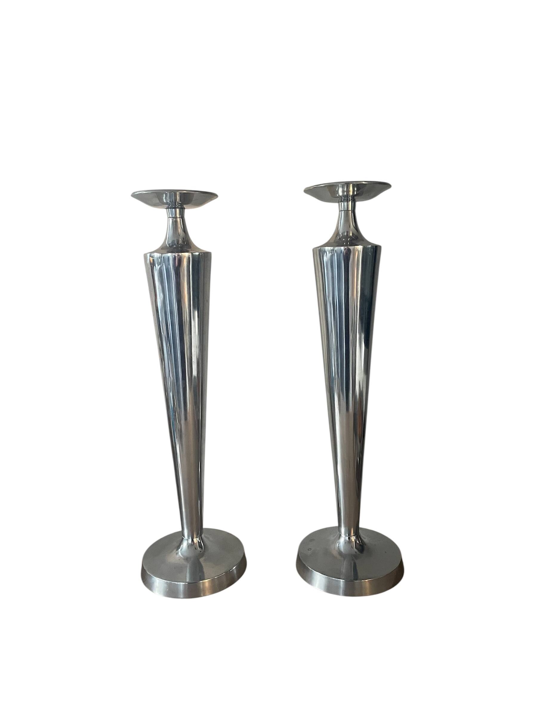 Pair of aluminium cast candle holders 52cm