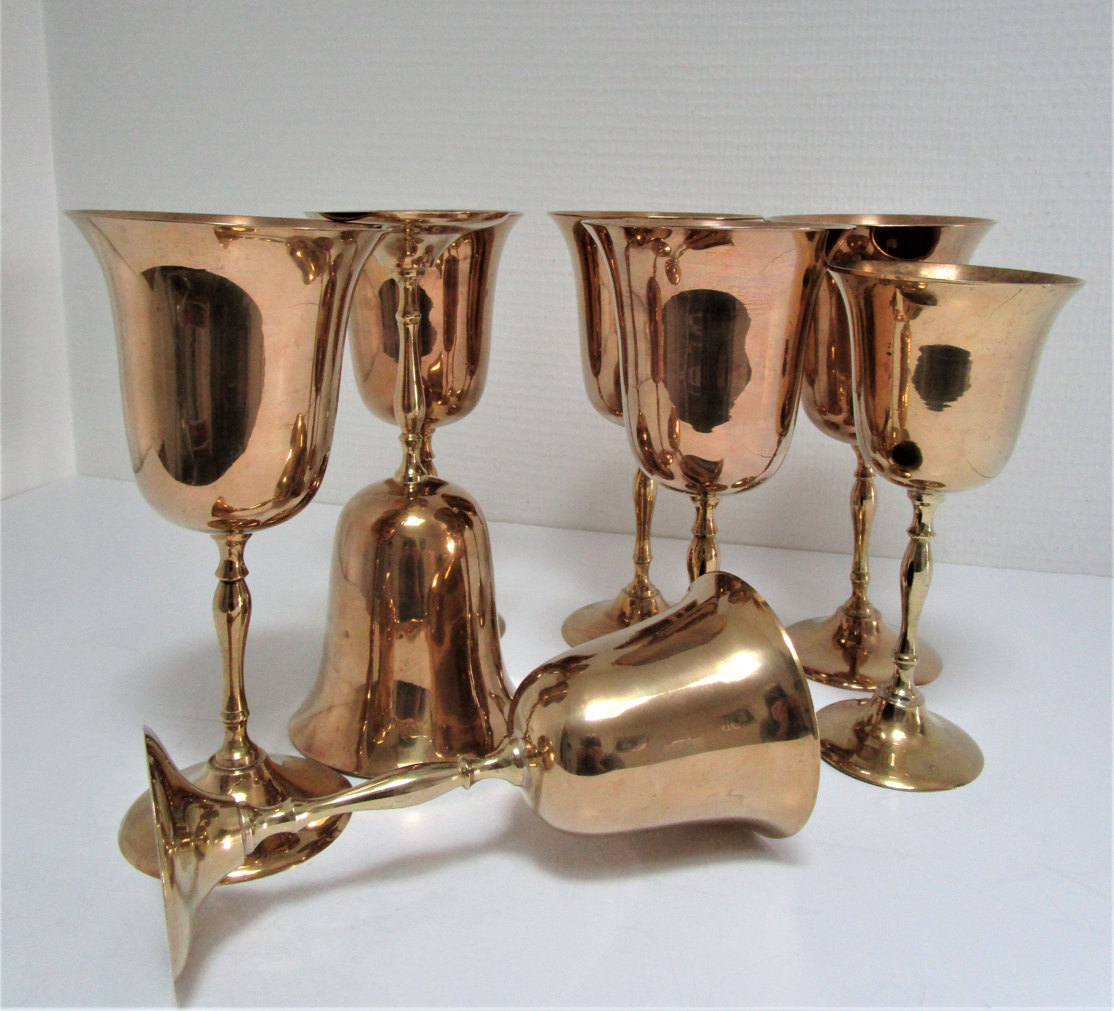 Set of eight vintage solid brass walking glasses