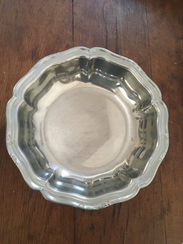 Two matching round dishes in stainless steel