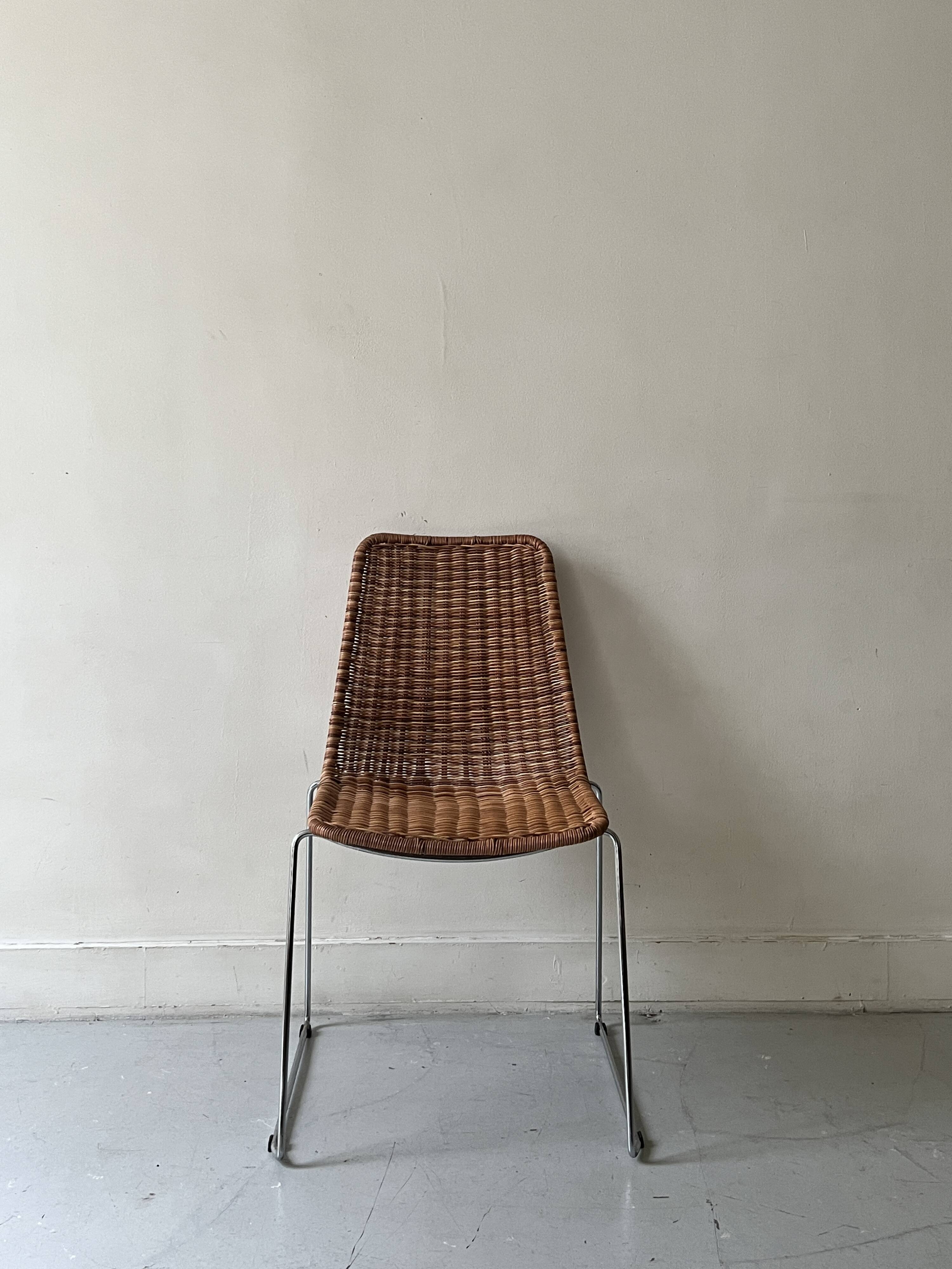 Chair made of rattan, wicker and chrome-plated metal