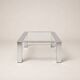 Table basse moderniste en acier chromé et verre clair — Europe, vers 1970