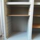 Vintage furniture transformed into a bookcase, verdigris patinated sideboard.