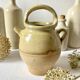 Old small goat-shaped jug in ochre glazed stoneware.