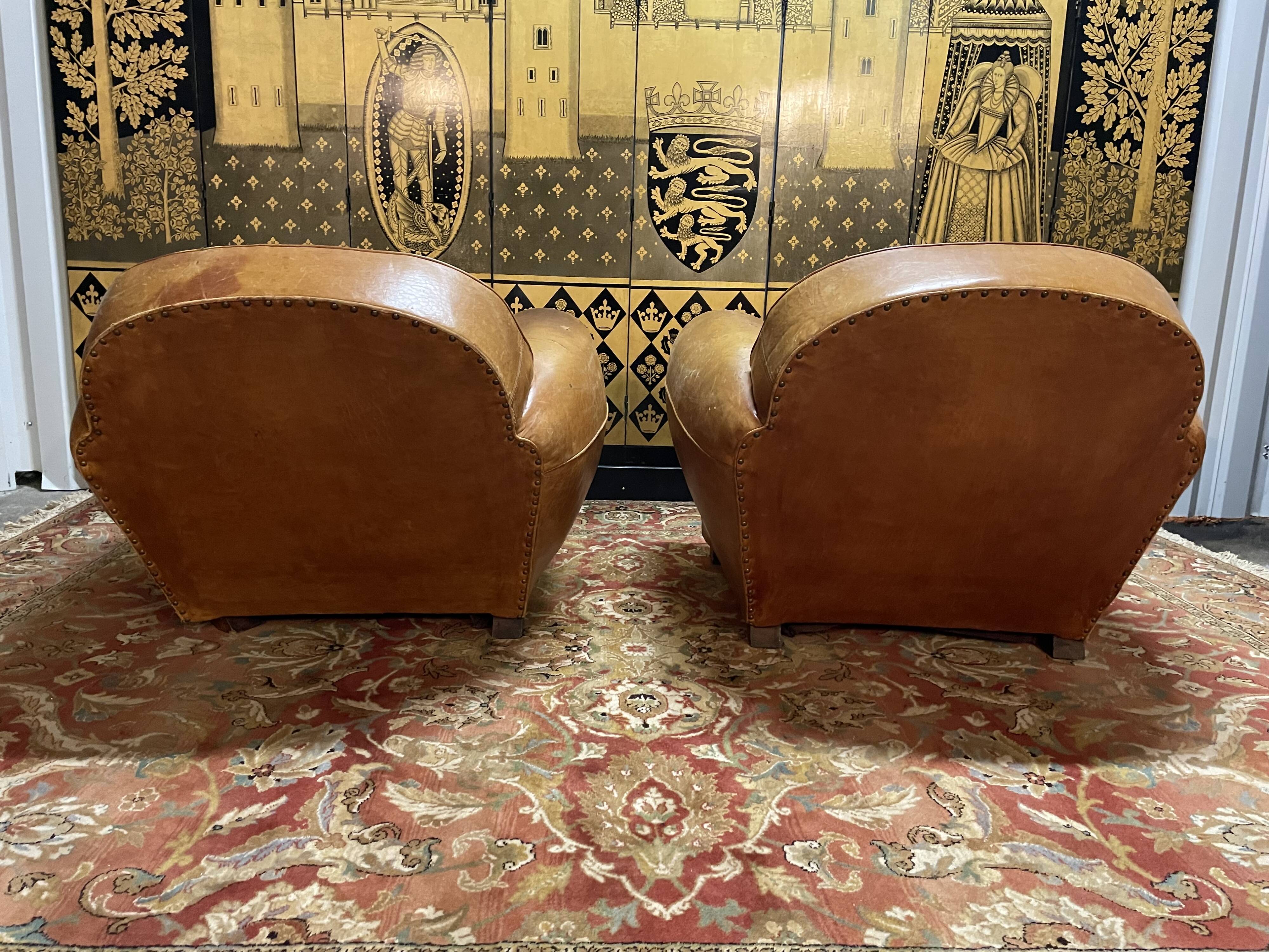 Pair of club armchairs in Havana leather 1950